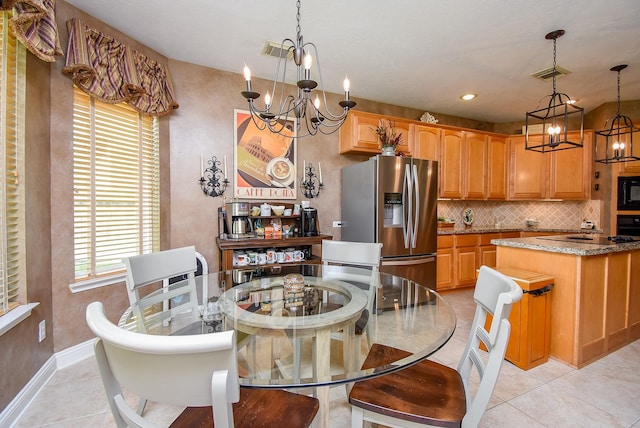 dining area featuring visible vents, baseboards, an inviting chandelier, and light tile patterned flooring