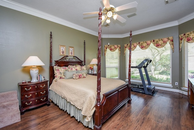 bedroom with dark wood finished floors, visible vents, and crown molding