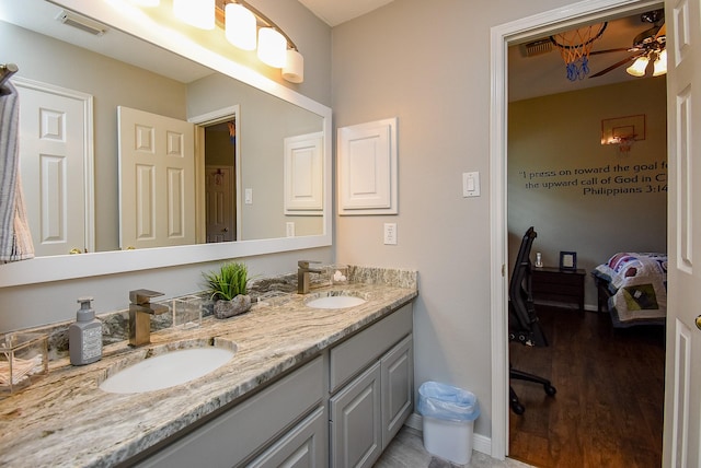 ensuite bathroom with a sink, visible vents, ensuite bath, and double vanity