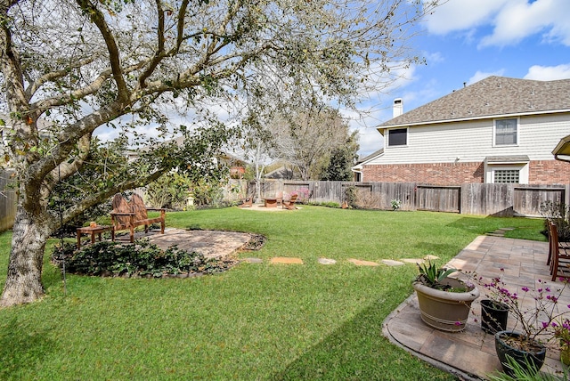 view of yard with a patio and a fenced backyard