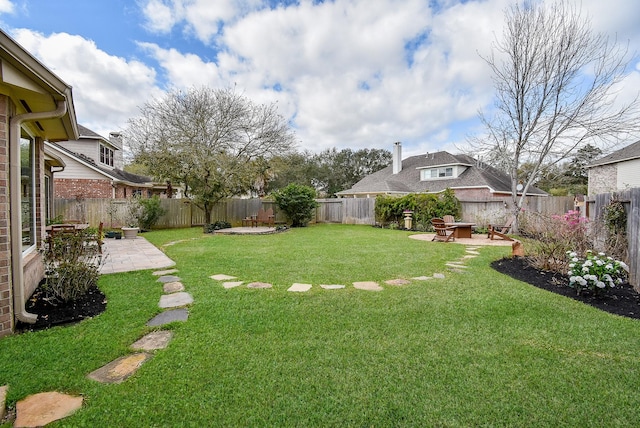 view of yard with a patio and a fenced backyard