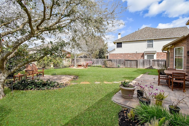 view of yard featuring a fenced backyard and a patio area