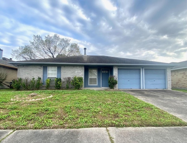 single story home featuring an attached garage, driveway, a front yard, and brick siding