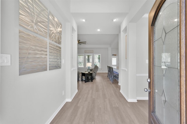 entrance foyer with a ceiling fan, recessed lighting, baseboards, and light wood finished floors