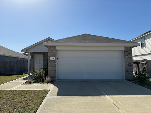 ranch-style house featuring driveway, brick siding, and fence