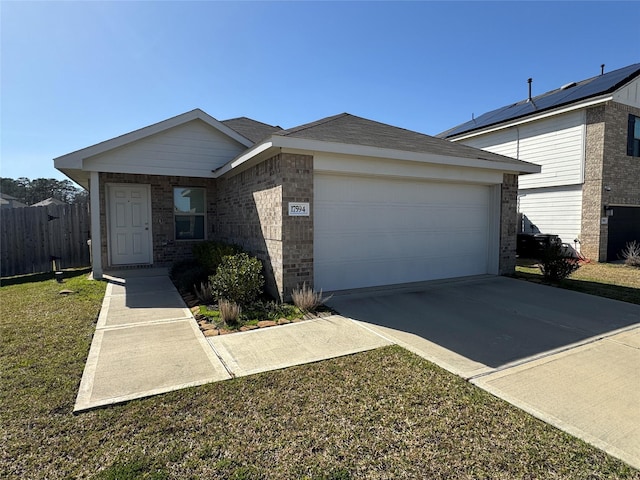 ranch-style home with driveway, brick siding, an attached garage, and fence