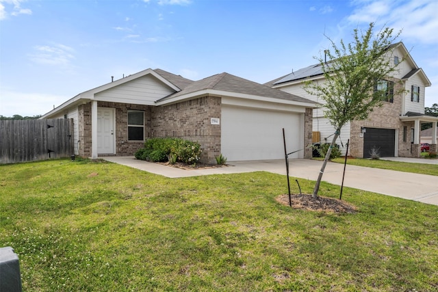 17594 Longwood Trace Ln, New Caney, TX 77357 - view of front of house with brick siding, driveway, and an attached garage