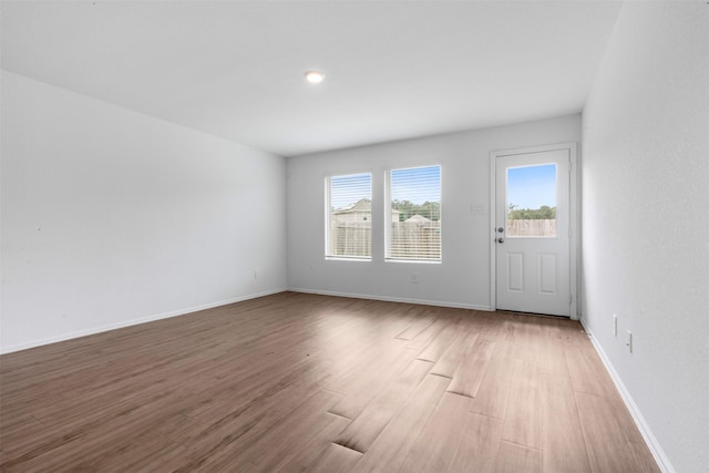 17594 Longwood Trace Ln, New Caney, TX 77357 - spare room with wood finished floors and baseboards