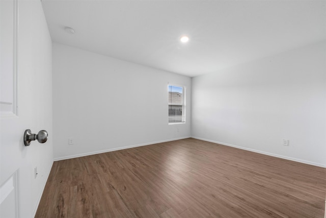 17594 Longwood Trace Ln, New Caney, TX 77357 - unfurnished room with wood finished floors, baseboards, a smoke detector, and recessed lighting