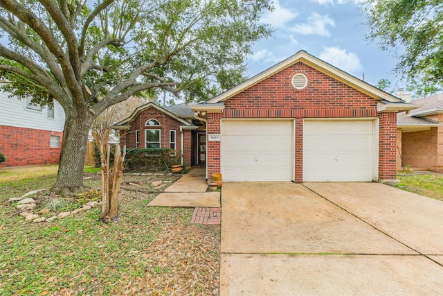 single story home featuring concrete driveway, brick siding, and an attached garage