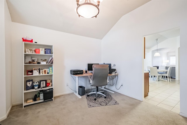 carpeted home office with tile patterned flooring and vaulted ceiling