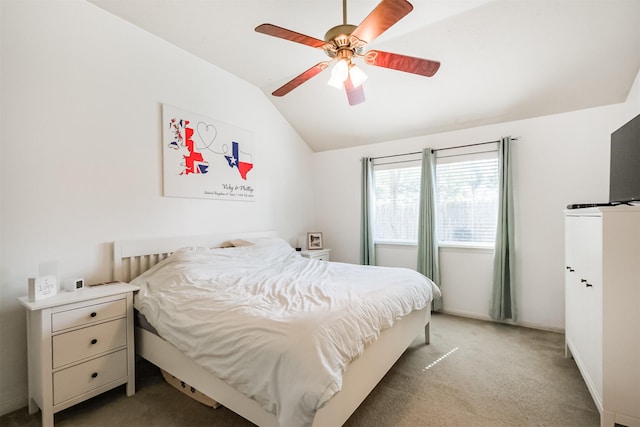 bedroom with ceiling fan, vaulted ceiling, and light colored carpet