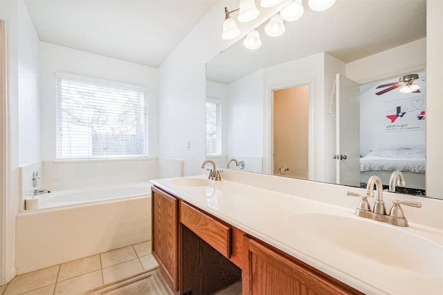 full bathroom featuring a bath, ensuite bathroom, a sink, and tile patterned floors