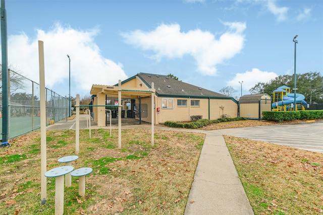 exterior space with brick siding and fence