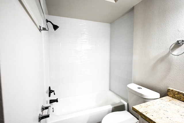 bathroom with  shower combination, a textured wall, vanity, and toilet