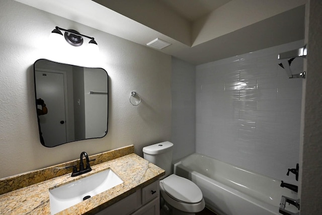 bathroom with visible vents, a textured wall, toilet, vanity, and shower / bathtub combination