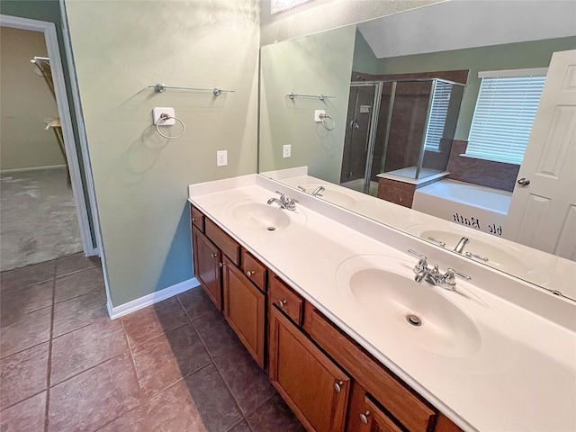 full bath featuring double vanity, a stall shower, a garden tub, and a sink