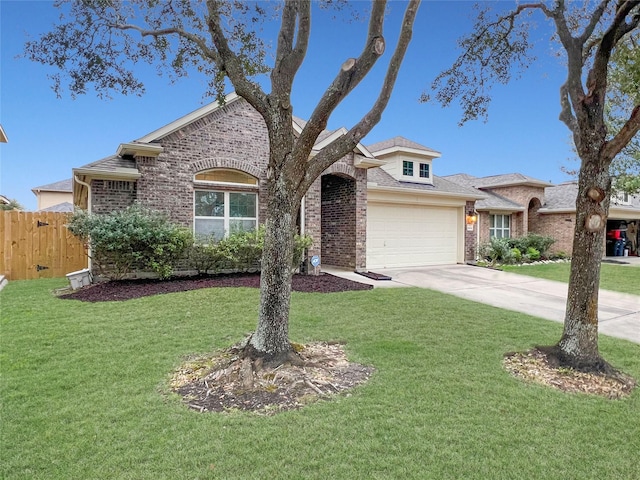 view of front of property with driveway, brick siding, an attached garage, and fence