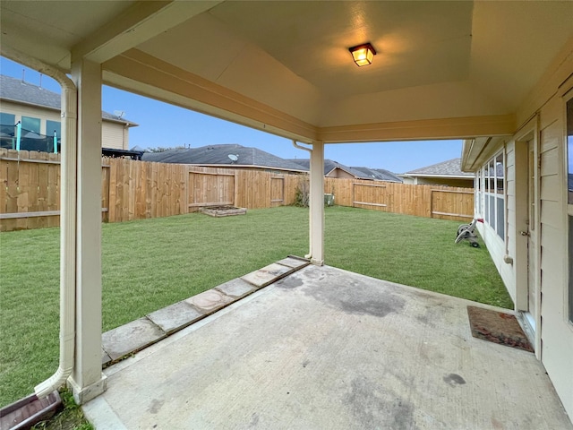 view of yard featuring a patio area and a fenced backyard