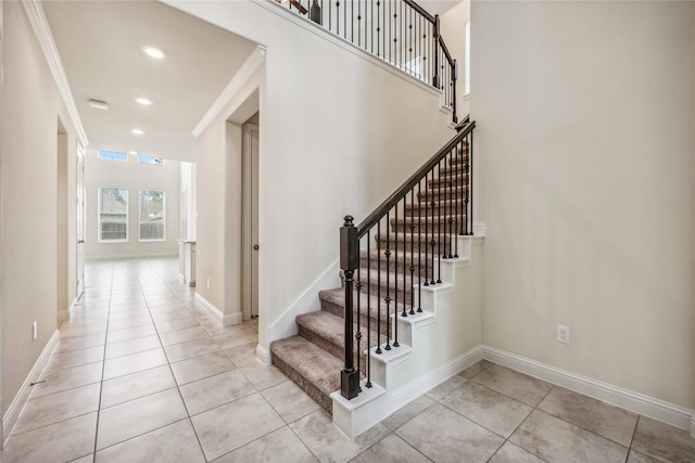 stairs featuring baseboards, recessed lighting, and tile patterned floors