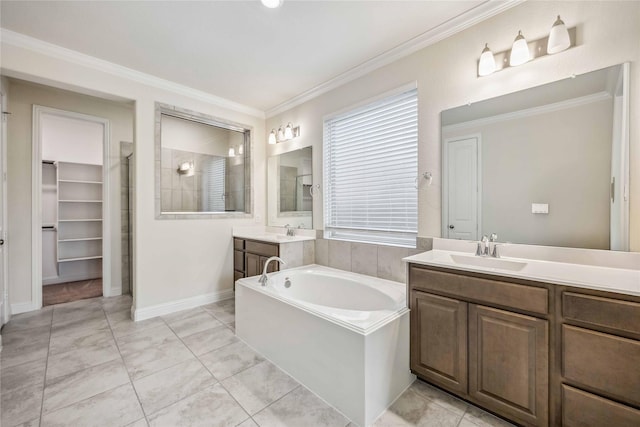 bathroom with crown molding, a tile shower, and a sink