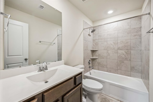 full bath featuring washtub / shower combination, visible vents, vanity, and toilet