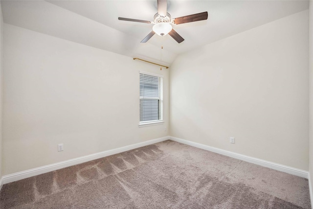 unfurnished room with ceiling fan, carpet, baseboards, and vaulted ceiling