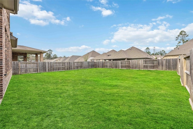 view of yard featuring a fenced backyard