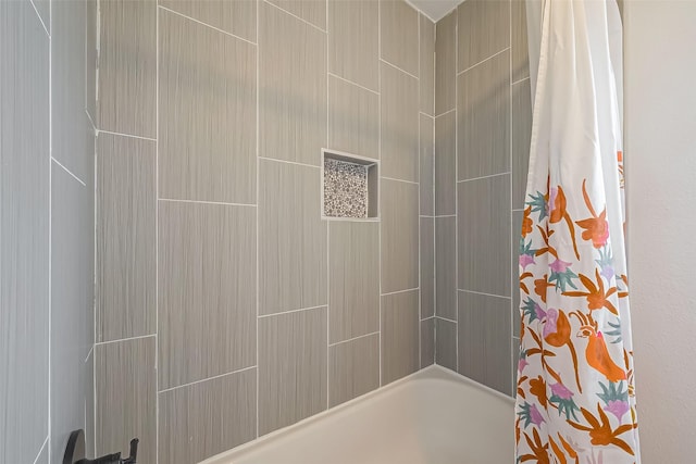 bathroom with shower / bathtub combination with curtain