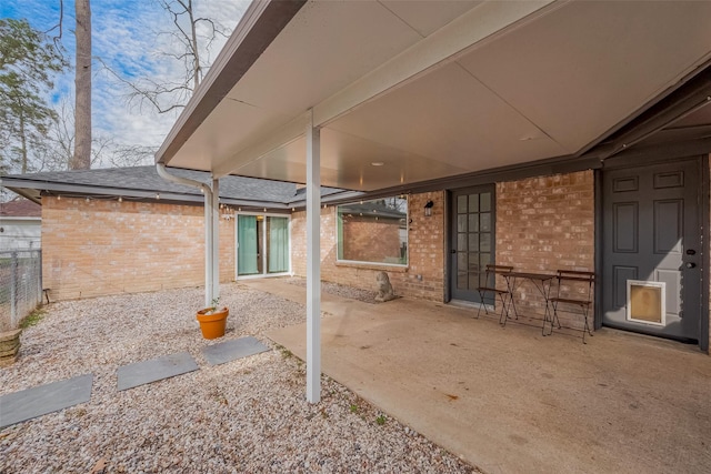 view of patio / terrace featuring fence