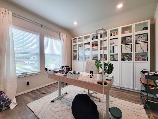 home office featuring baseboards, vaulted ceiling, wood finished floors, and recessed lighting