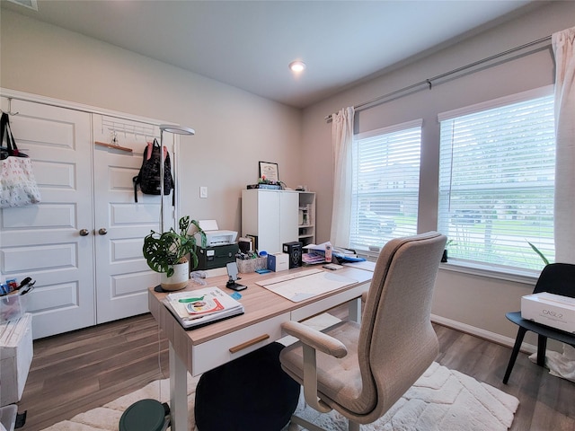 home office featuring recessed lighting, wood finished floors, visible vents, and baseboards