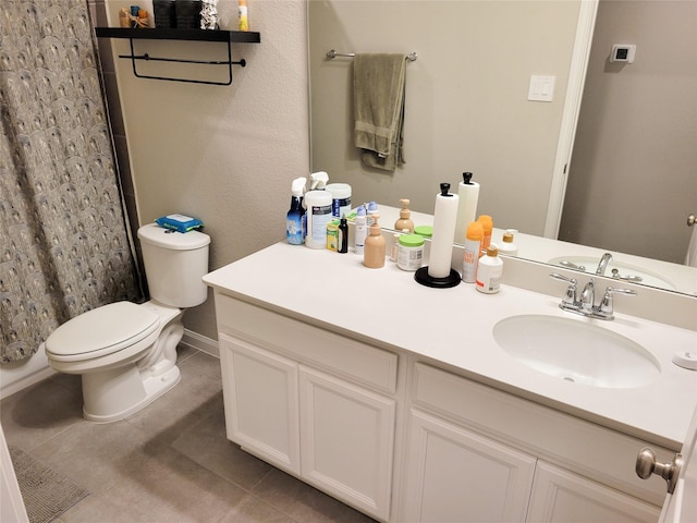 bathroom featuring a shower with curtain, vanity, toilet, and tile patterned floors