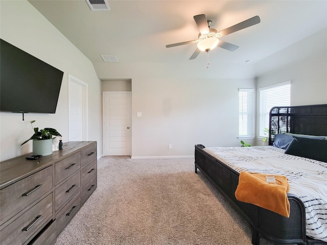 bedroom with baseboards, a ceiling fan, visible vents, and light colored carpet