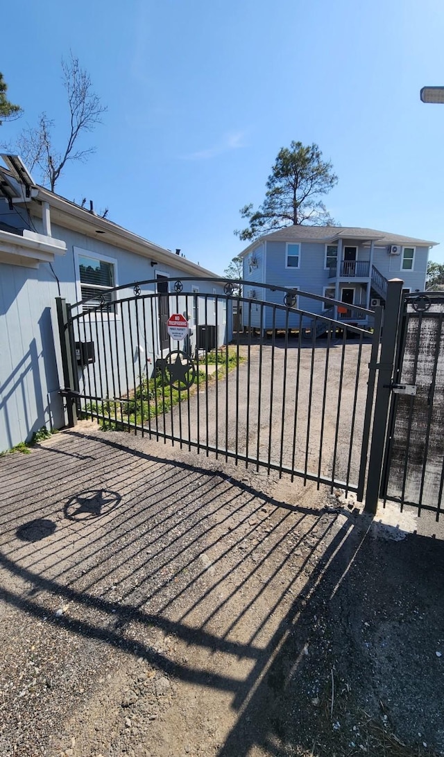 view of gate with fence