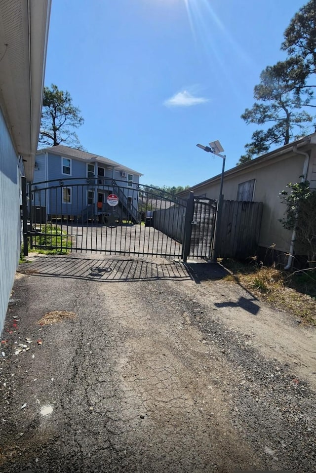 view of gate featuring fence