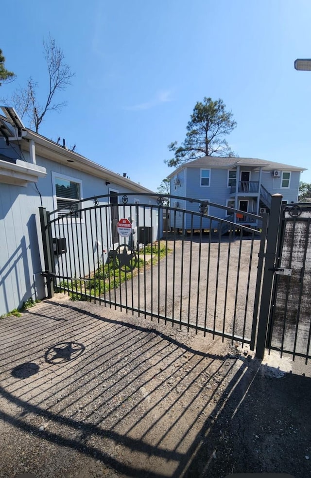 view of gate featuring fence