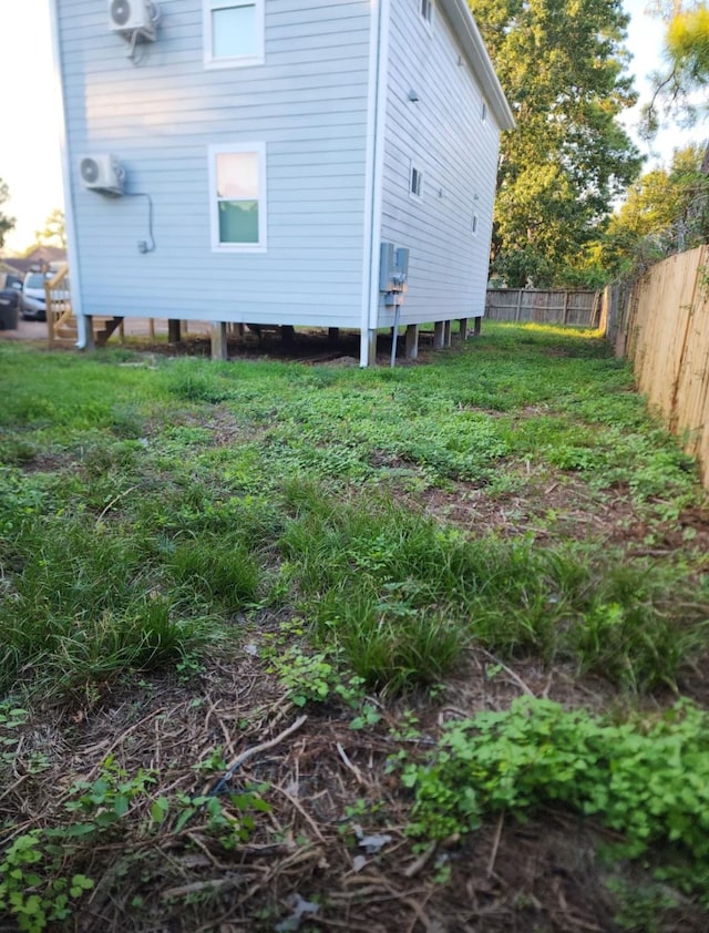 view of property exterior featuring fence