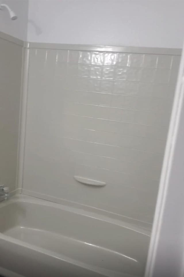 bathroom featuring  shower combination