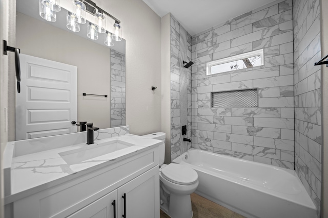 bathroom with toilet, bathtub / shower combination, and vanity