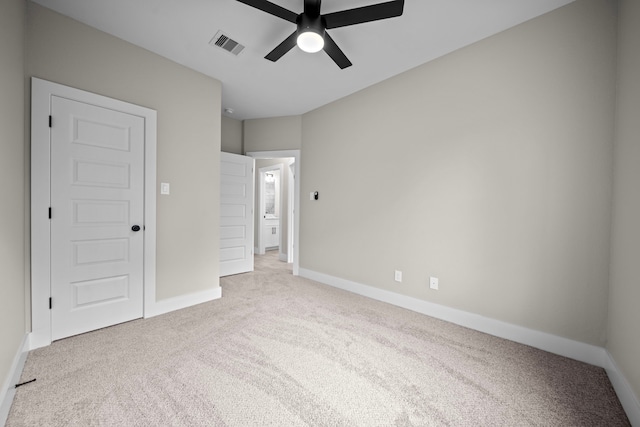 unfurnished bedroom with baseboards, visible vents, ceiling fan, and carpet flooring