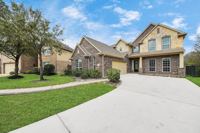 view of front of property with a garage, concrete driveway, brick siding, and a front lawn