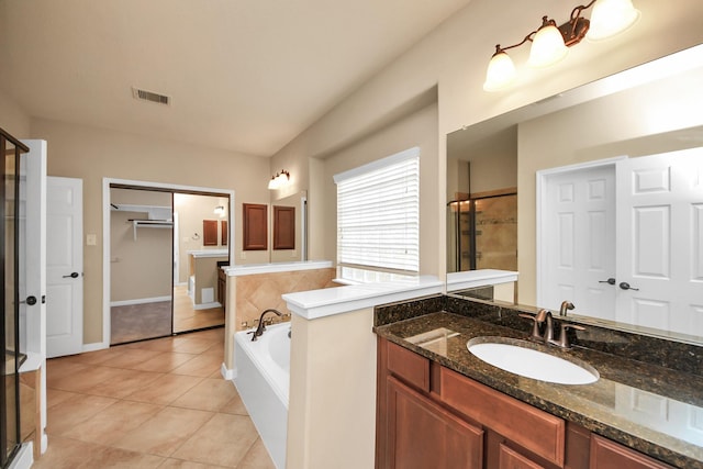 full bath featuring visible vents, a stall shower, vanity, tile patterned flooring, and a bath