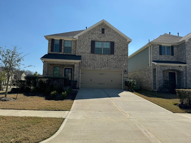 traditional home featuring driveway, brick siding, and an attached garage