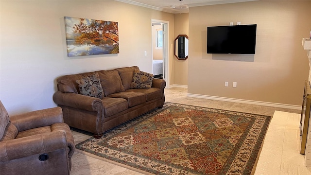 living room featuring ornamental molding and baseboards