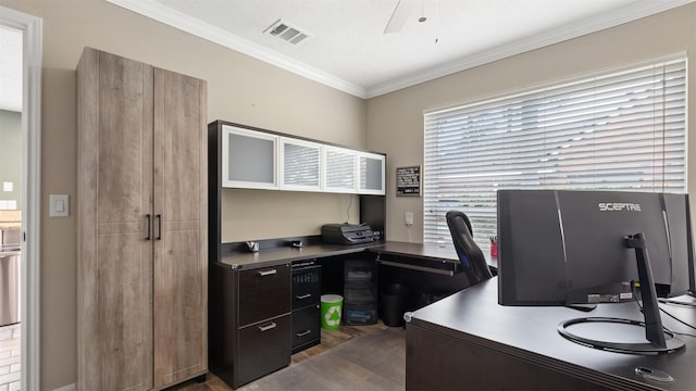 home office featuring visible vents, a ceiling fan, and ornamental molding