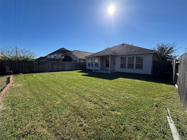 view of yard featuring a fenced backyard