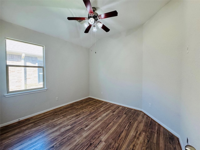 unfurnished room with ceiling fan, baseboards, and wood finished floors