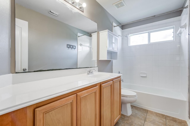 full bathroom featuring tile patterned flooring, toilet, visible vents, vanity, and bathing tub / shower combination