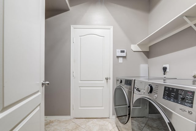 laundry room featuring laundry area, light tile patterned floors, and independent washer and dryer